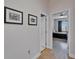 Hallway with wood floors leading to a bedroom at 718 S 22Nd St, Tampa, FL 33605