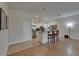 Open-concept kitchen featuring stainless steel appliances, white cabinetry, and bar seating area at 718 S 22Nd St, Tampa, FL 33605