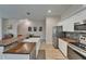 Modern kitchen featuring stainless steel appliances, white cabinetry, butcher block countertops and breakfast bar at 718 S 22Nd St, Tampa, FL 33605