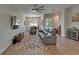 Spacious living room with wood floors, stylish furniture, and ceiling fan at 718 S 22Nd St, Tampa, FL 33605