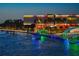 View of the Tampa Museum of Art with colorful lights and illuminated pier by the water at 718 S 22Nd St, Tampa, FL 33605