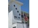 Building exterior featuring building number and American flag waving on a sunny day at 8080 112Th St # 107, Seminole, FL 33772