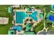 Aerial view of the community pool area including swimming lanes, splash pad, water slide and picnic cabanas at 8125 Stone Path Way, Tampa, FL 33647