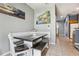 Eat-in kitchen featuring built-in bench seating and view to the hallway at 8125 Stone Path Way, Tampa, FL 33647