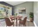 Cozy dining room with large windows offering peaceful views, perfect for gatherings at 8125 Stone Path Way, Tampa, FL 33647