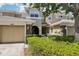 Charming townhome exterior with well-manicured landscaping and inviting curb appeal at 8125 Stone Path Way, Tampa, FL 33647