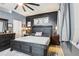 Dark main bedroom boasts stylish decor, including a large bed, side tables, and tasteful wall art at 8125 Stone Path Way, Tampa, FL 33647