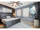 The main bedroom is a luxurious space with a large bed, a TV, and stylish decor creating a cozy and modern retreat at 8125 Stone Path Way, Tampa, FL 33647