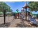 Community playground with slides, climbing structures, and a soft play surface at 8125 Stone Path Way, Tampa, FL 33647
