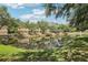 Waterfront property overlooking tranquil pond, mature trees and landscaped surroundings at 8125 Stone Path Way, Tampa, FL 33647