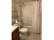 Standard bathroom featuring a toilet, vanity, and bathtub with shower at 825 S Village N Dr # 201, St Petersburg, FL 33716