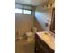 This bathroom features a new vanity, toilet, and mirror at 825 S Village N Dr # 201, St Petersburg, FL 33716