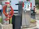 Close-up of Foam & Spray car wash station with vacuum cleaner hose in an outdoor parking lot at 825 S Village N Dr # 201, St Petersburg, FL 33716