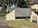 Attractive signage welcomes residents to Village Lake Condominiums in a well maintained community at 825 S Village N Dr # 201, St Petersburg, FL 33716