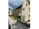Property featuring clean landscaping with parking space; ideal for residents and visitors at 825 S Village N Dr # 201, St Petersburg, FL 33716
