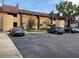Exterior shot of the property with parking spaces and landscaping, perfect for potential homeowners at 825 S Village N Dr # 201, St Petersburg, FL 33716