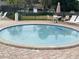 Inviting hot tub area with lounge chairs, perfect for relaxing by the pool at 825 S Village N Dr # 201, St Petersburg, FL 33716