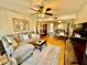 Bright living room with cozy seating and adjacent dining area at 825 S Village N Dr # 201, St Petersburg, FL 33716