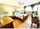 A beautiful main bedroom suite with hardwood floors and natural light at 825 S Village N Dr # 201, St Petersburg, FL 33716