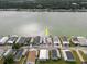 Aerial view showcases waterfront property with solar panels and parking with easy lake access and boating at 8444 Fantasia Park Way, Riverview, FL 33578