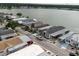 Aerial view of a waterfront community, showcasing well-maintained homes and convenient street parking at 8444 Fantasia Park Way, Riverview, FL 33578