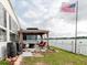 Waterfront backyard featuring a gazebo with lake view at 8444 Fantasia Park Way, Riverview, FL 33578