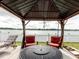 Open air gazebo with outdoor seating overlooking a lake at 8444 Fantasia Park Way, Riverview, FL 33578