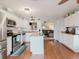 Bright kitchen featuring stainless steel appliances, a center island, and hardwood flooring at 8444 Fantasia Park Way, Riverview, FL 33578