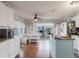 Bright kitchen with white cabinets, stainless steel appliances, and a cozy dining nook at 8444 Fantasia Park Way, Riverview, FL 33578