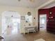 Open floor plan with a view of the kitchen, dining area, and access to the main bedroom at 8444 Fantasia Park Way, Riverview, FL 33578