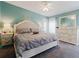 Relaxing main bedroom with a plush bed, decorative accents, and ample natural light at 8444 Fantasia Park Way, Riverview, FL 33578