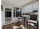 Outdoor patio with glass windows, a table set, and view of the outside at 8444 Fantasia Park Way, Riverview, FL 33578
