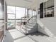 Enclosed porch with view of the water and lakefront gazebo at 8444 Fantasia Park Way, Riverview, FL 33578