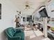 Bright sunroom with comfortable seating, ceiling fan, and lots of windows overlooking the outdoor area at 8444 Fantasia Park Way, Riverview, FL 33578