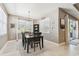 This dining room offers a stylish chandelier, neutral color palette, and easy access to the outdoor area at 8628 Eagle Brook Dr, Land O Lakes, FL 34638