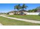 Charming home featuring manicured lawn, mature landscaping, and an attached two car garage at 8628 Eagle Brook Dr, Land O Lakes, FL 34638