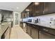 Well-appointed kitchen with dark wood cabinetry, stainless steel appliances, and granite countertops at 8628 Eagle Brook Dr, Land O Lakes, FL 34638