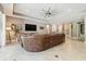 Spacious living room features a large leather sectional, recessed lighting, and neutral decor at 8628 Eagle Brook Dr, Land O Lakes, FL 34638