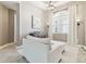 Bright living room showcasing a large window with curtains, light-colored walls, and elegant decor at 8628 Eagle Brook Dr, Land O Lakes, FL 34638