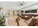 Open floor plan showcases a seamless flow from living room to modern kitchen with a large leather sectional at 8628 Eagle Brook Dr, Land O Lakes, FL 34638