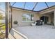 The patio showcases a covered area, a grill, a TV, and outdoor seating perfect for entertaining at 8628 Eagle Brook Dr, Land O Lakes, FL 34638