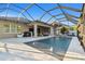 Enjoy this screened-in pool with a fire pit, water features, and ample patio space for entertaining at 8628 Eagle Brook Dr, Land O Lakes, FL 34638