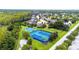Aerial view of tennis and basketball courts in a landscaped community at 8628 Eagle Brook Dr, Land O Lakes, FL 34638