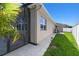 Landscaped side yard with view of screened in patio at 8628 Eagle Brook Dr, Land O Lakes, FL 34638