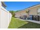 A well-maintained yard showing the side of the home and partial fence at 8628 Eagle Brook Dr, Land O Lakes, FL 34638