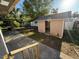 Backyard with small outbuilding, perfect for storage and organization at 9618 N 13Th St, Tampa, FL 33612