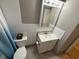 Updated bathroom with tile flooring and a modern vanity at 9618 N 13Th St, Tampa, FL 33612