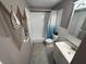 Bathroom with coastal decor featuring tub, and vanity at 9618 N 13Th St, Tampa, FL 33612