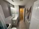 Cozy bathroom with updated vanity and coastal decor at 9618 N 13Th St, Tampa, FL 33612