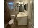Bathroom featuring a vanity with storage and decor at 9618 N 13Th St, Tampa, FL 33612